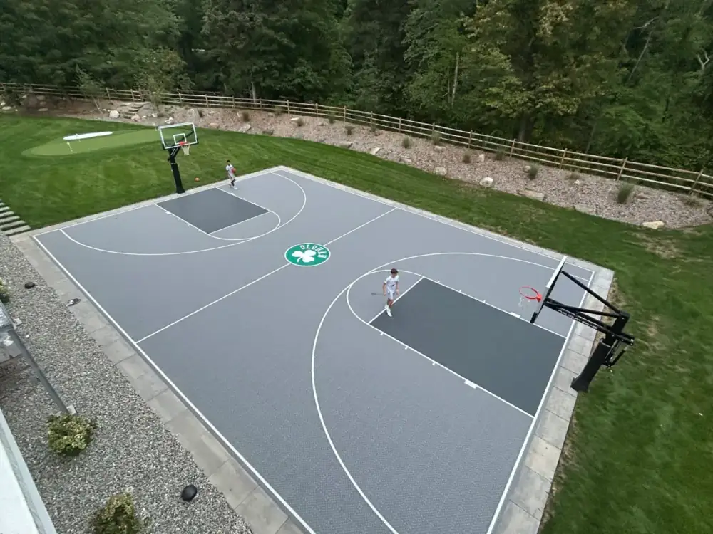 Backyard basketball court with custom logo