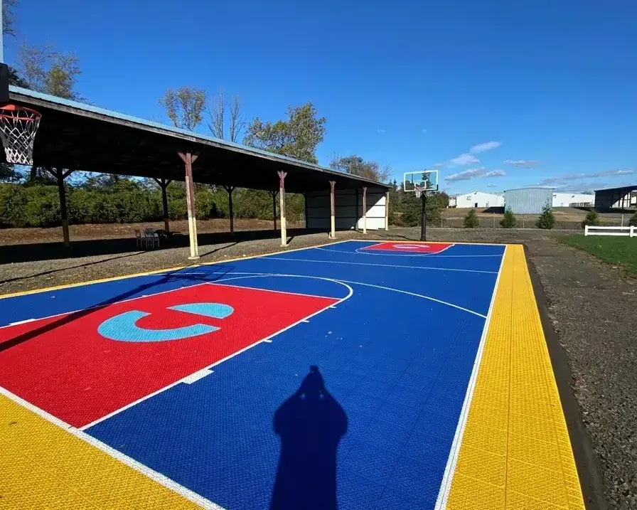 Backyard family basketball court built with GTC modular sport court tiles